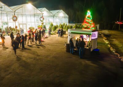 AC Celebrations set up outside Robinson's Greenhouse for the Christmas Market infront of a large lit up Christmas Tree