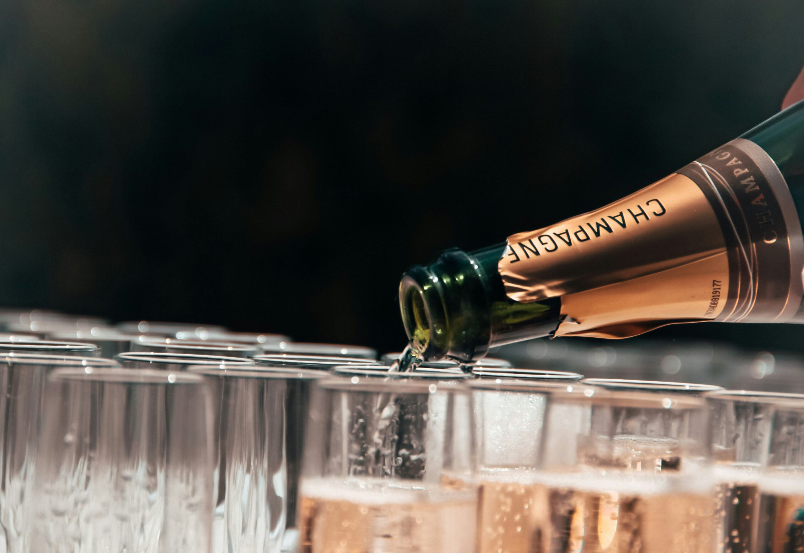 tristan-gassert-IRzq8sDxb7w-unsplash AC Celebrations pour champagne for a wedding or engagement party